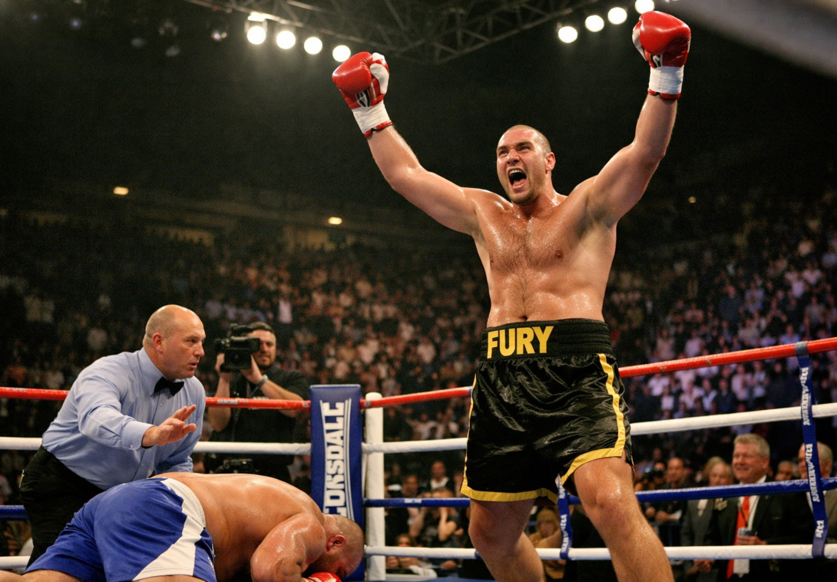 Tyson Fury celebrates first professional victory in the ring during his Tyson Fury professional boxing career